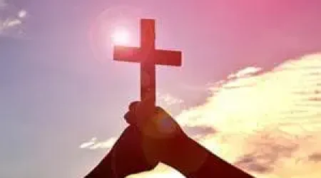 Faith-Christian-Cross-Hands-Sky-Sun-Glare_credit-Shutterstock