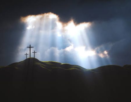 The sky over Golgotha Hill is shrouded in majestic light and clouds, revealing the holy cross symbolizing the death and resurrection of Jesus Christ.
